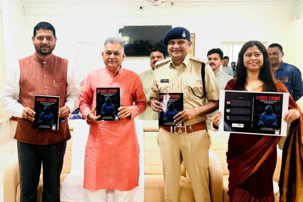 Higher Education Minister releases book titled “Cyber Crime Prevention & Fraud Management” in Indore.